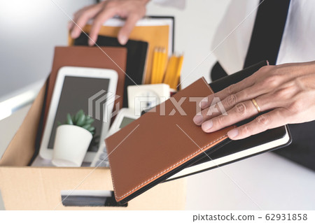 Sad Fired Young Employee businessmen hold boxes 62931858