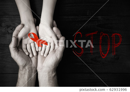 Stop AID red ribbon in hand 62931996