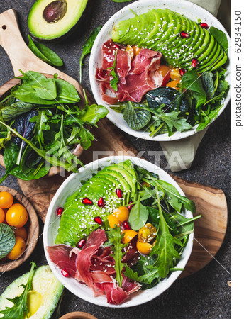 Low carbs bowl. Fresh salad with green spinach, 62934150