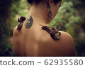 Beauty portrait on young stylish woman with snails 62935580