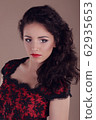 Closeup portrait of beautiful sexy brunette with 62935653