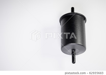 New fuel filter in a black plastic housing for diesel and gasoline engines on a gray background New fuel filter in a black plastic housing for diesel and gasoline engines on a gray background 62935683