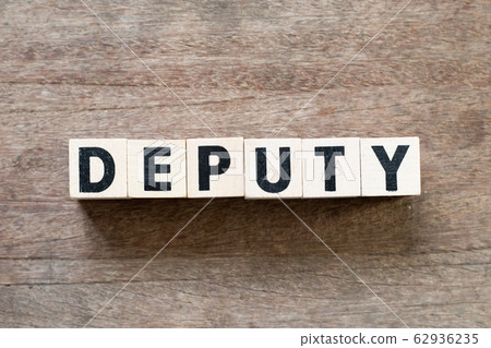 Letter block in word deputy on wood background Letter block in word deputy on wood background 62936235