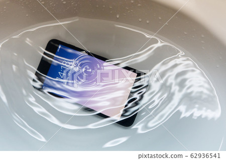 Close-up on Water Proof Smartphone Drop in to the Close-up on Water Proof Smartphone Drop in to the 62936541