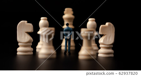 Figures businessman standing in front of wooden Figures businessman standing in front of wooden 62937820