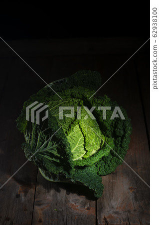Fresh savoy cabbage from organic grower farm on rustic wooden table, antioxidant food Fresh savoy cabbage from organic grower farm on rustic wooden table, antioxidant food 62938100