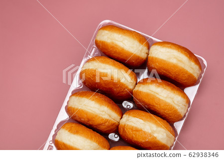 traditional polish donuts in a box on pink traditional polish donuts in a box on pink 62938346