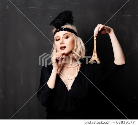 Beautiful blonde woman in twenties years clothes Beautiful blonde woman in twenties years clothes 62939177