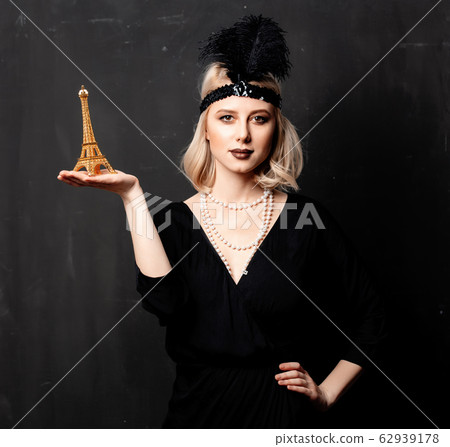 Beautiful blonde woman in twenties years clothes Beautiful blonde woman in twenties years clothes 62939178