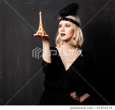 Beautiful blonde woman in twenties years clothes Beautiful blonde woman in twenties years clothes 62939179
