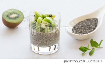 Healthy vegan chia pudding in a glass with fresh kiwi 62940411