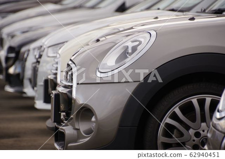 Imported cars mini cars lined up at dealerships 62940451
