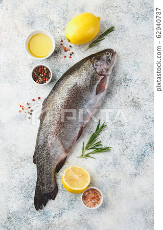 Raw rainbow trout light background 62940787