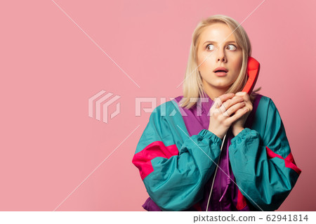 Beautiful blonde woman in 90s clothes with headset Beautiful blonde woman in 90s clothes with headset 62941814