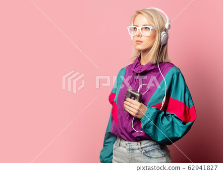 woman in 90s clothes with headphones woman in 90s clothes with headphones 62941827