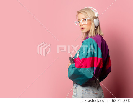 woman in 90s clothes with headphones woman in 90s clothes with headphones 62941828