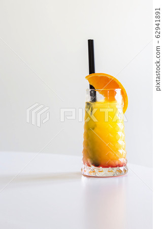 Tequila sunrise cocktail isolated on a gray background Tequila sunrise cocktail isolated on a gray background 62941891
