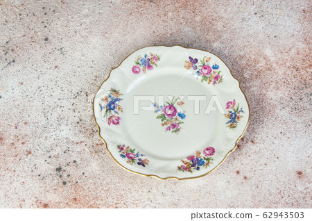 Antique porcelain dish on concrete Antique porcelain dish on concrete 62943503