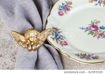 Antique porcelain plate on concrete 62943509