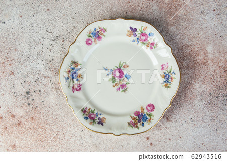 Antique porcelain dish on concrete Antique porcelain dish on concrete 62943516