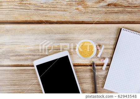 A white note book with cup of coffee digital A white note book with cup of coffee digital 62943548