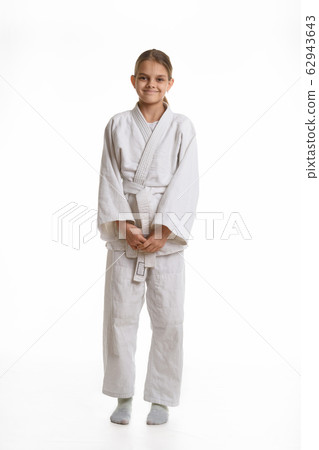 Funny and humble girl in a kimono, isolated on a Funny and humble girl in a kimono, isolated on a 62943643