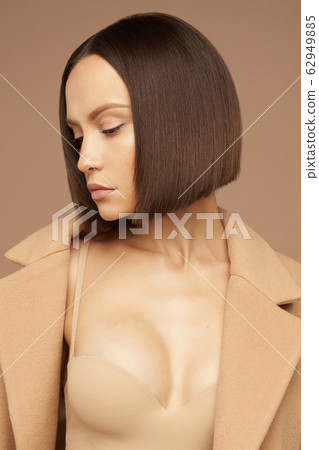 Fashion beautiful lady in beige coat Fashion beautiful lady in beige coat 62949885