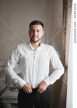 Beautiful man, groom posing and preparing for wedding 62951830
