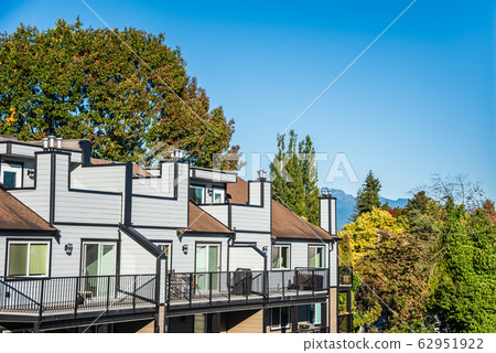 Top of new residential building on blue sky background 62951922