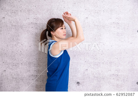 A woman playing basketball A woman playing basketball 62952087