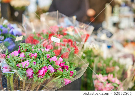 Bunches of different colorful flowers in buckets on street flower market in Anemone, poppy Bunches of different colorful flowers in buckets on street flower market in Anemone, poppy 62952565