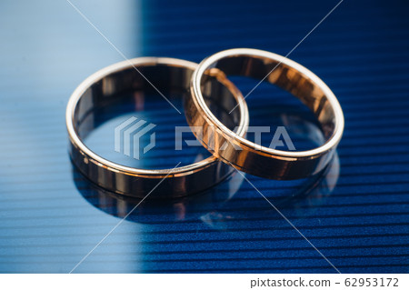 two traditional wedding gold engagement rings close-up two traditional wedding gold engagement rings close-up 62953172