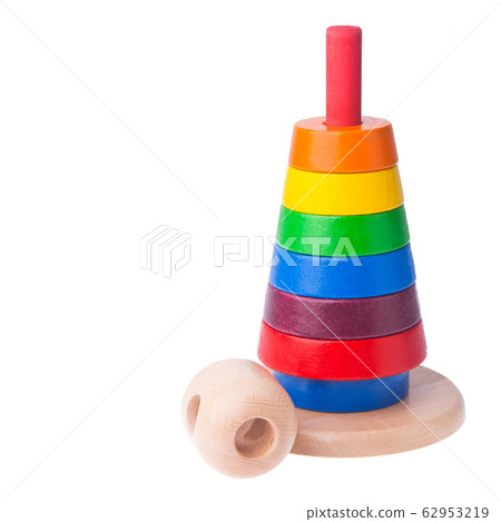 Toy or baby toy wood color pyramid on background Toy or baby toy wood color pyramid on background 62953219