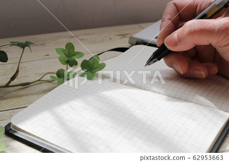 Senior hand writing in notebook Senior hand writing in notebook 62953663