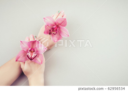 Manicure and flowers. Manicure and flowers. 62956534