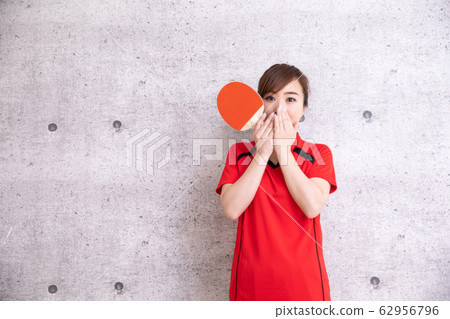 Woman playing table tennis 62956796