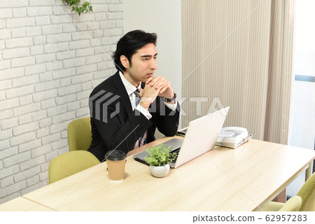 Men crossing hands in front of face 62957283