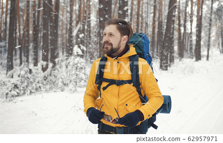 Backpacker putting off sunglasses portrait 62957971