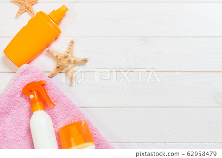 beach accessories on a white wooden background top beach accessories on a white wooden background top 62958479