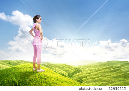 Asian runner woman take a break after running 62959225