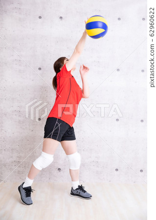 Woman playing volleyball Woman playing volleyball 62960622
