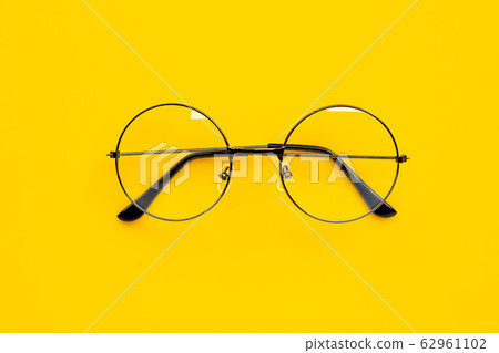 Eye Glasses on yellow background. Eye Glasses on yellow background. 62961102