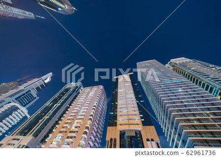 Looking up to high-rise office buildings, 62961736