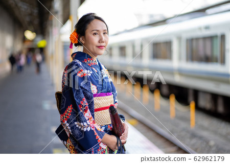 Geishas girl wearing Japanese kimono among in 62962179