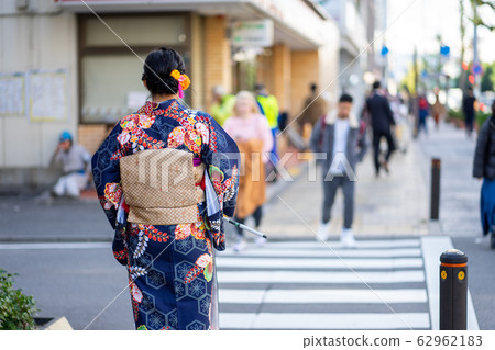 Geishas girl wearing Japanese kimono among in 62962183