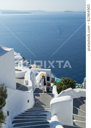Stairs leading to the Aegean Sea, walking through the spectacular view of Santorini 62964905