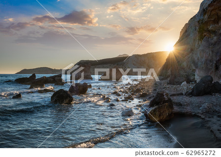 Fyriplaka beach on sunset, Milos island, Cyclades, Greece Fyriplaka beach on sunset, Milos island, Cyclades, Greece 62965272