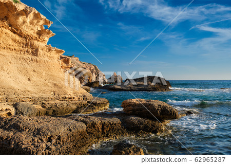Fyriplaka beach on sunset, Milos island, Cyclades, Greece Fyriplaka beach on sunset, Milos island, Cyclades, Greece 62965287