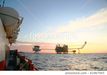 Offshore construction platform in the gulf or the sea. Offshore oil and gas industry in service business or power business. 62967945