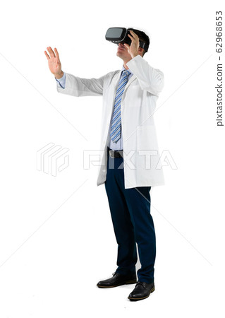 Caucasian businessman wearing a Virtual Reality headset Caucasian businessman wearing a Virtual Reality headset 62968653